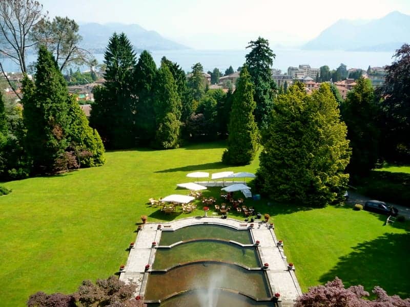 Villa Muggia, Stresa, Piemonte: garden, the villa's tiered water staircase and century-old park seen from the villa terrace, with Lake Maggiore and the mountains behind.
